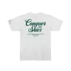 T-shirt with the words Conquer the Skies on it in large print, with a smaller quote below it.